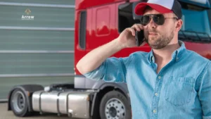 Arrow Dispatch Services hotshot driver in Fort Worth coordinating fast hotshot trucking delivery with a red semi-truck.